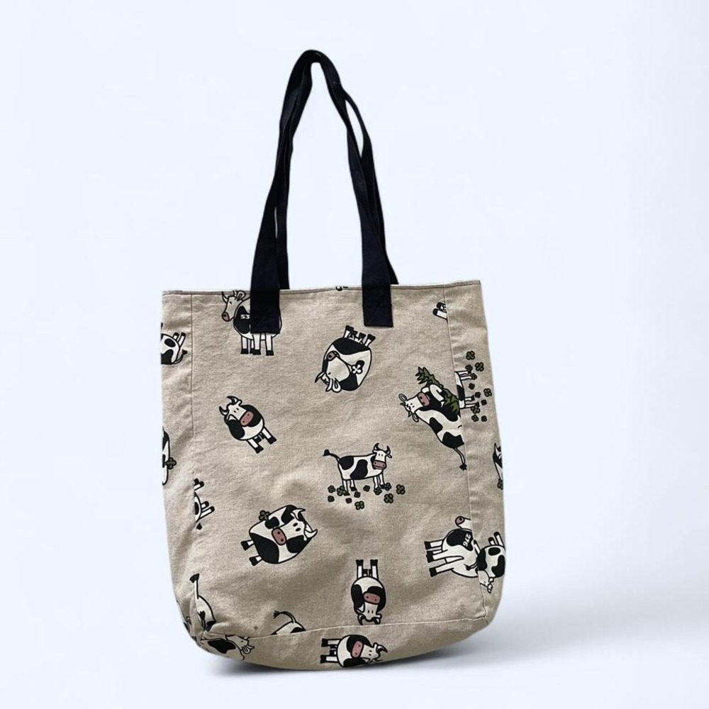 Beige canvas tote bag‎ with cartoon cow print pattern